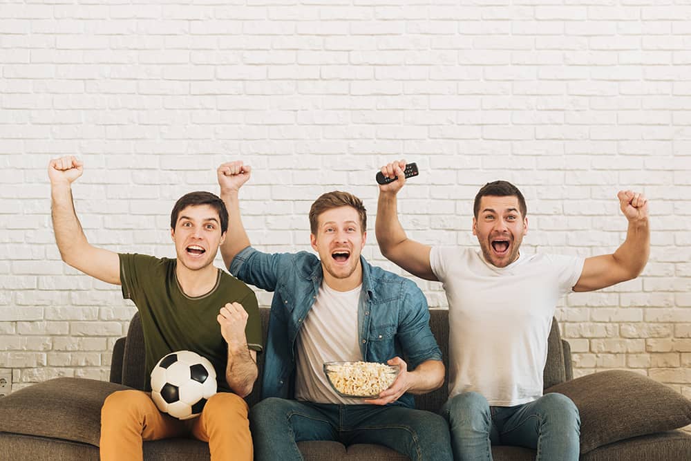 friends cheering watching soccer